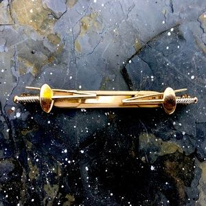 Gold tone sword tie clip